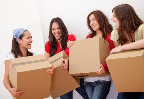 Staff following safe storage procedures in a warehouse